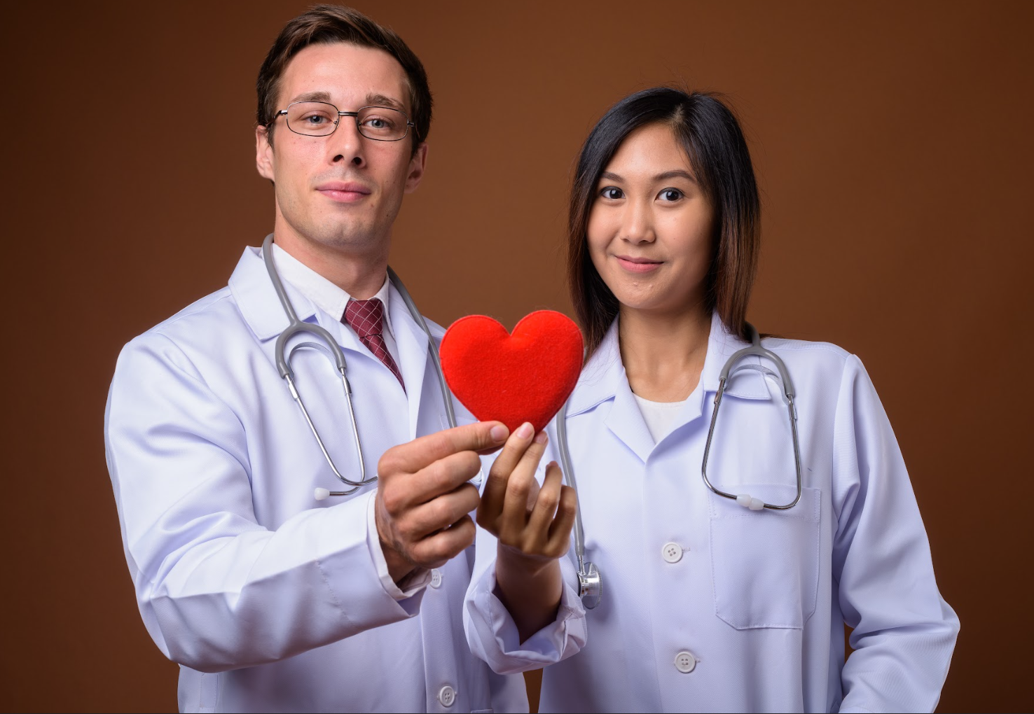 physician couple with heart